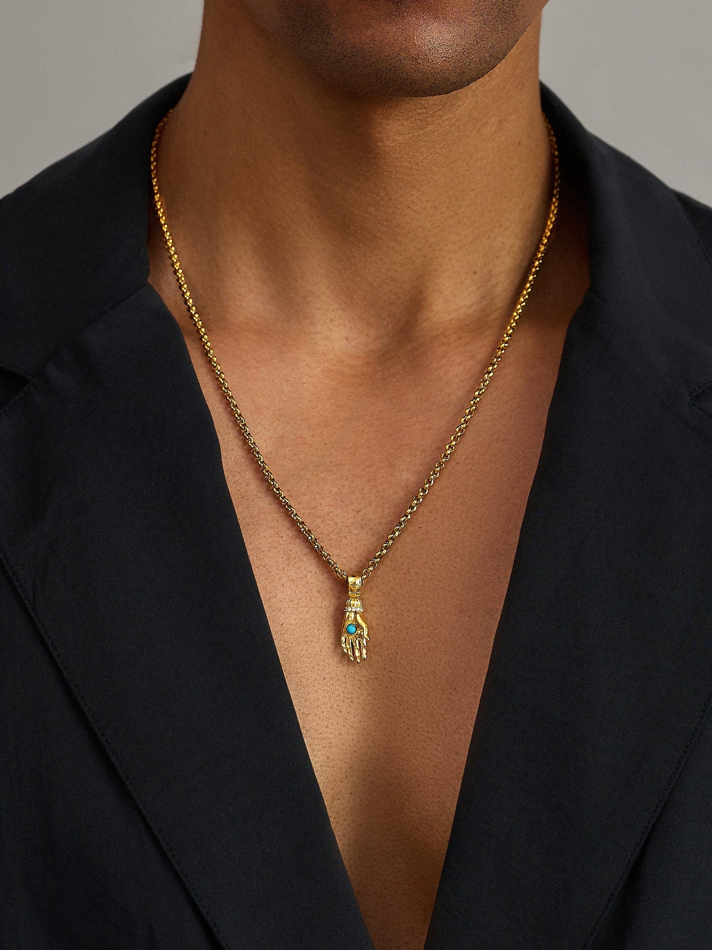Men's Hand Pendant with a Small Turquoise Gemstone in Gold