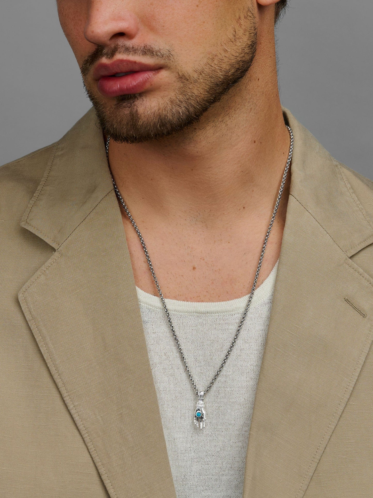 Men's Hand Pendant with a Small Turquoise Gemstone in Silver